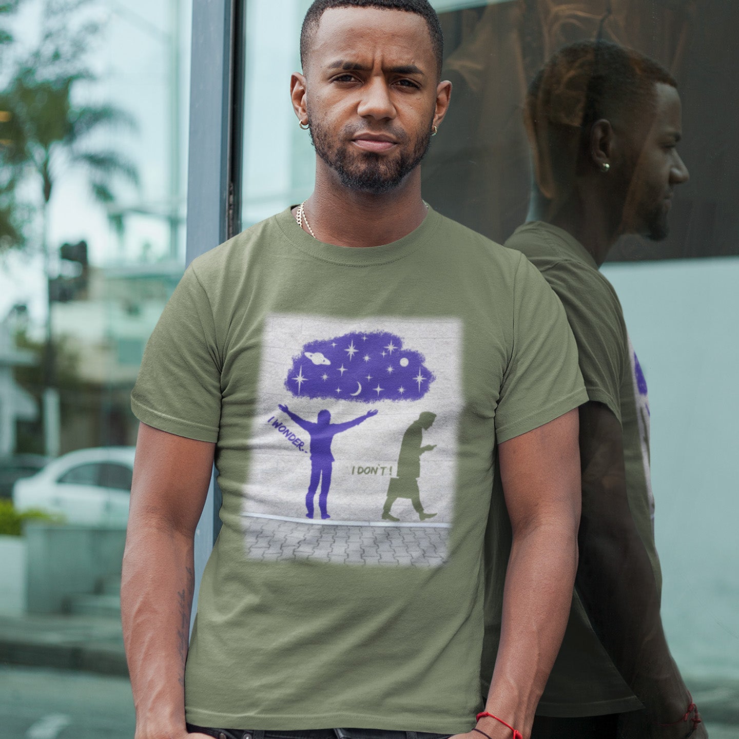 Man wearing a khaki t-shirt with a graphic design outdoors. This anti mobile phone abuse t shirt light heartedly pokes fun at people who never look up from their phone. If you believe letting a machine do most of your thinking for you will dull your imagination, this satirical design is for you. Made from 100% organic ring-spun cotton, these anti mobile phone abuse t shirts are unisex, high quality, super comfy, and best of all, eco-friendly.