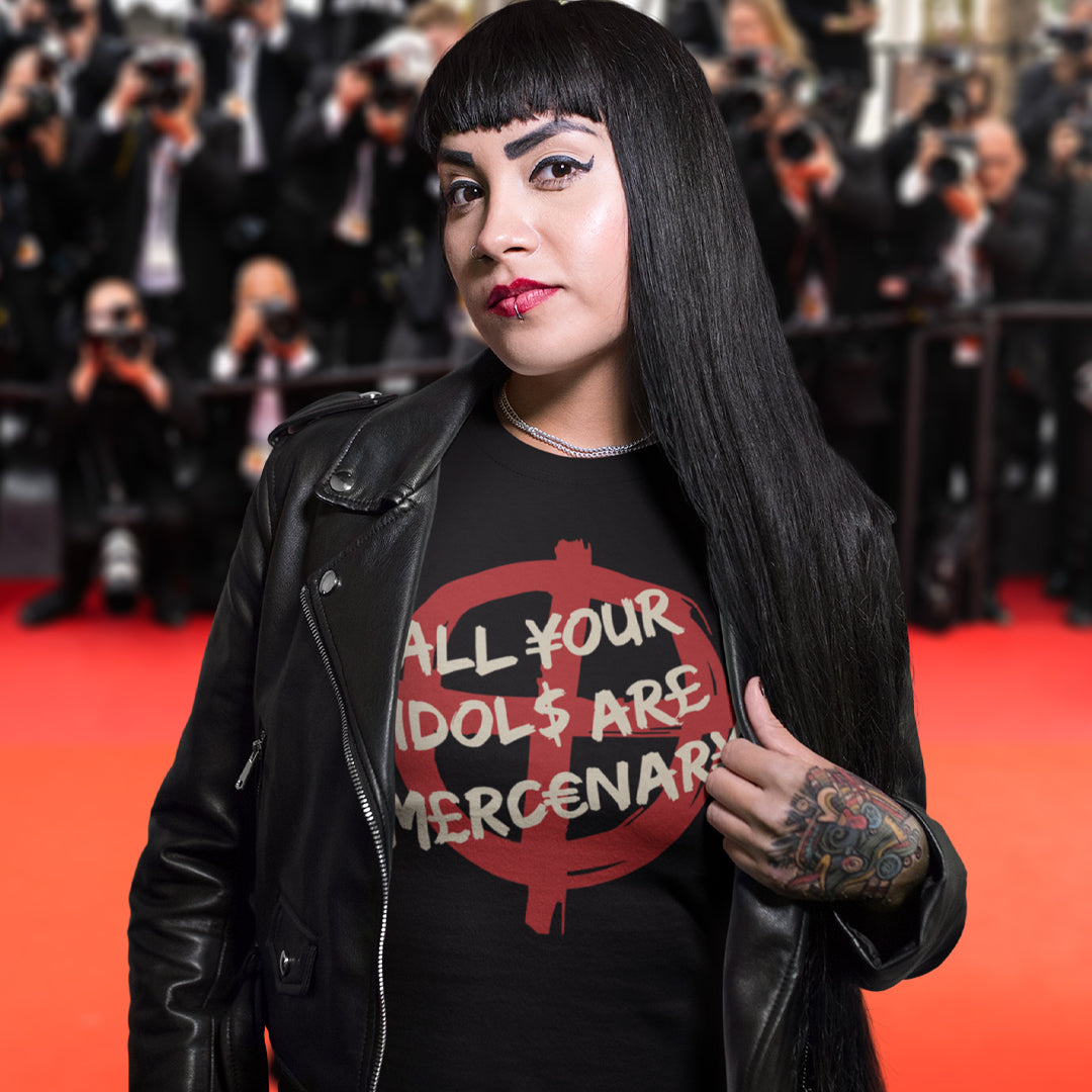 Person wearing a black t-shirt with a red and white graphic and text on a red carpet. This broken society t shirt shows the dark side of capitalism. Why are we looking up to people that put money before integrity, what is it we admire, their bank accounts ? Are there any products that celebrities or sports personalities wouldn't sell ? Made from 100% organic ring-spun cotton, this anti capitalism t shirt is unisex, high-quality, super comfy, and best of all, eco-friendly.
