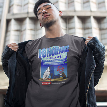 Person wearing a t-shirt with a graphic design and text, standing outdoors. This broken society t shirt comes in the form of a cleaning solution. A very satirical and sarcastic view of how ignorance has become the number one reaction to most of the problems facing modern society. Burying your head in the sand has always been a very popular but hazardous solution. Made from 100% organic ring-spun cotton, these social issues t shirts are unisex, high quality, super comfy, and best of all, eco-friendly.