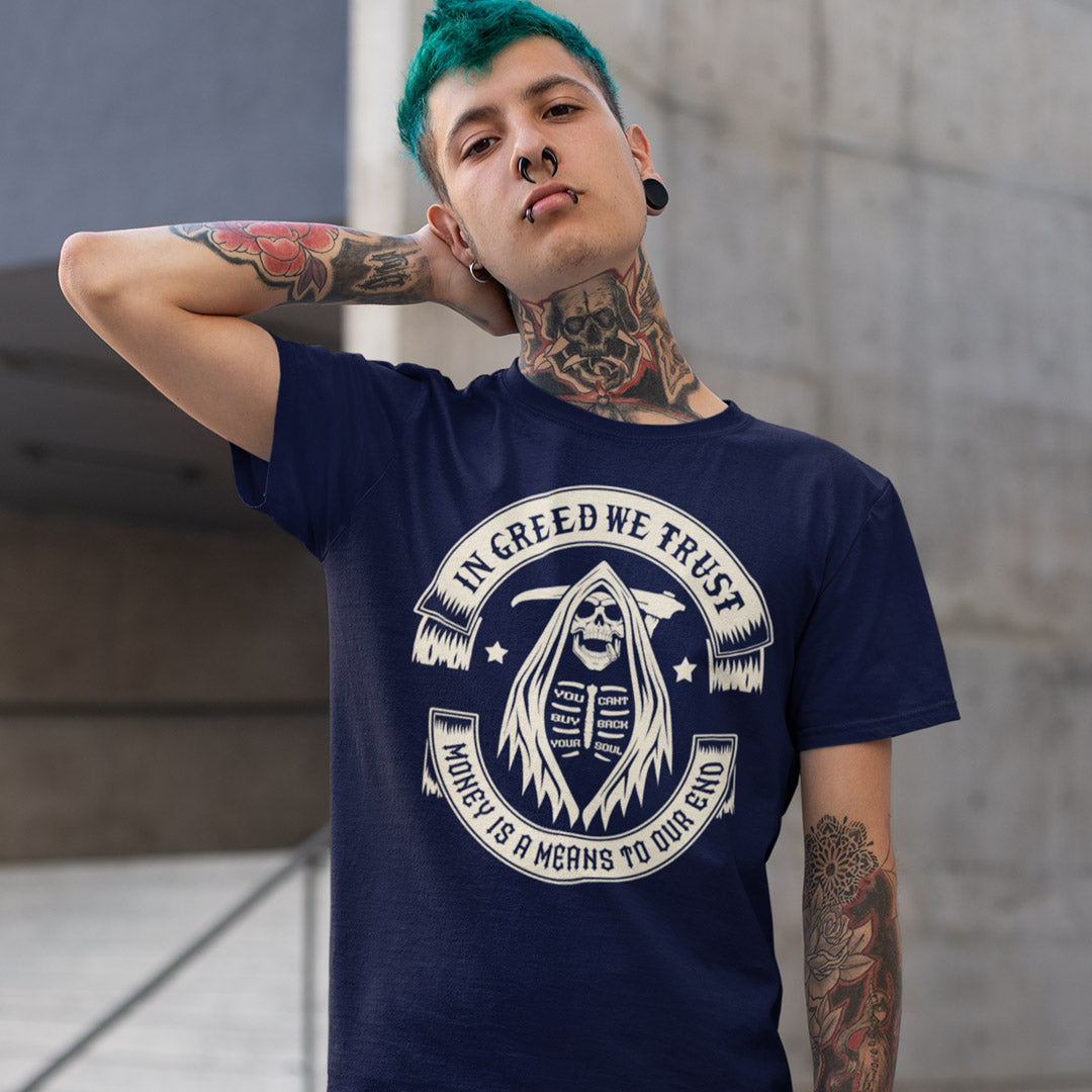 Person wearing a navy blue t-shirt with a graphic design and text. A broken society t shirt implying we have made greed our new God. If you believe our obsession with money is lowering the standards of society, help create social awareness with this anti capitalism t shirt. Could it be that money worship will be the end of us ? Made from 100% organic ring-spun cotton, this broken society t shirt is unisex, high quality, super comfy, and best of all, eco-friendly.