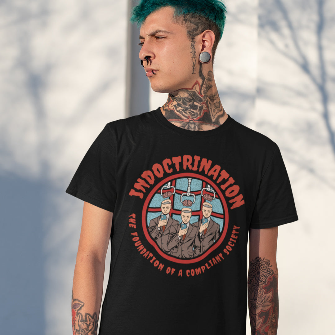 Person wearing a black t-shirt with a graphic design and text. A conspiracy theory t shirt exposing indoctrination as the foundation of modern society. What we believe before we realise we are being lied to shapes our lives until we take back our own opinions. Made from 100% organic ring-spun cotton, this non conformist t shirt is unisex, high quality, super comfy, and best of all, eco-friendly.