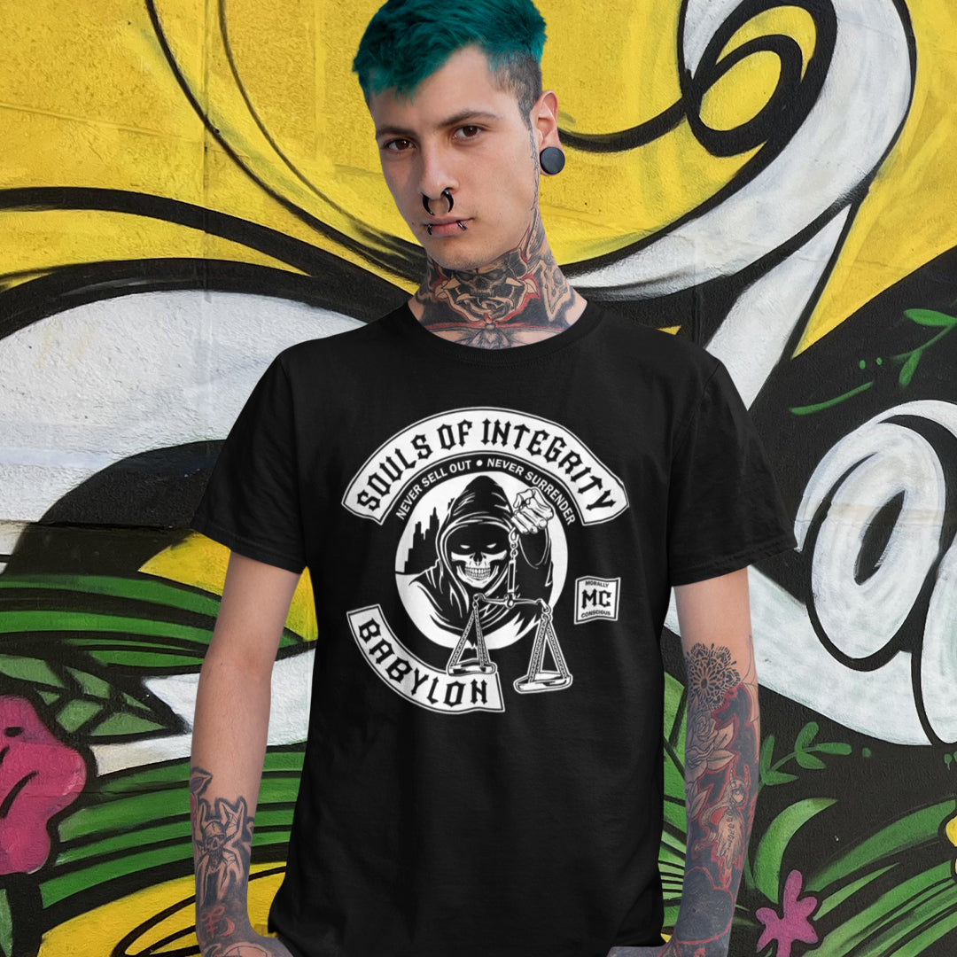 Person wearing a black t-shirt with a logo and text, standing in front of a colourful mural. A social awareness t shirt promoting ethics and morality. A spoof motorcycle club design for people who still have integrity. This design satirically representing how few people are left with a moral conscience in a corrupt world, or as the Rastafarians call it, BABYLON. Made from 100% organic ring-spun cotton, these social issues t shirts are unisex, high-quality, super comfy, and best of all, eco-friendly.