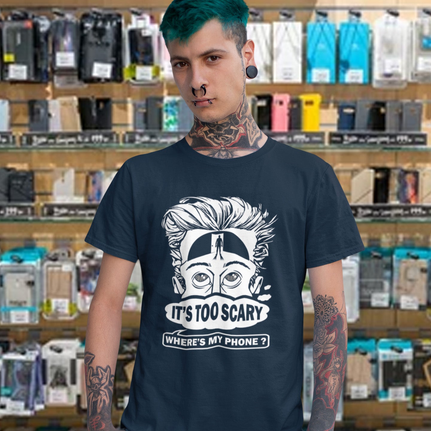 Person wearing a French navy t-shirt with a graphic design and text in a store setting. An anti-mobile phone abuse t-shirt highlighting the effects on the mind of smart phone over use in the place of thinking. A view of how mobile phones have taken over thinking and left us with dark unexplored corridors in our minds. Made from 100% organic ring-spun cotton, this social awareness t-shirt is unisex, high-quality, super comfy, and best of all, eco-friendly.