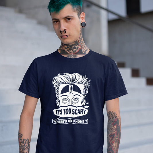 A blue haired man standing next to steps, wearing a French navy blue short-sleeve crewneck t-shirt featuring a white graphic print of a cartoon face with wild hair and the text 'IT'S TOO SCARY WHERE'S MY PHONE?' on the front, displayed against a solid white background.
