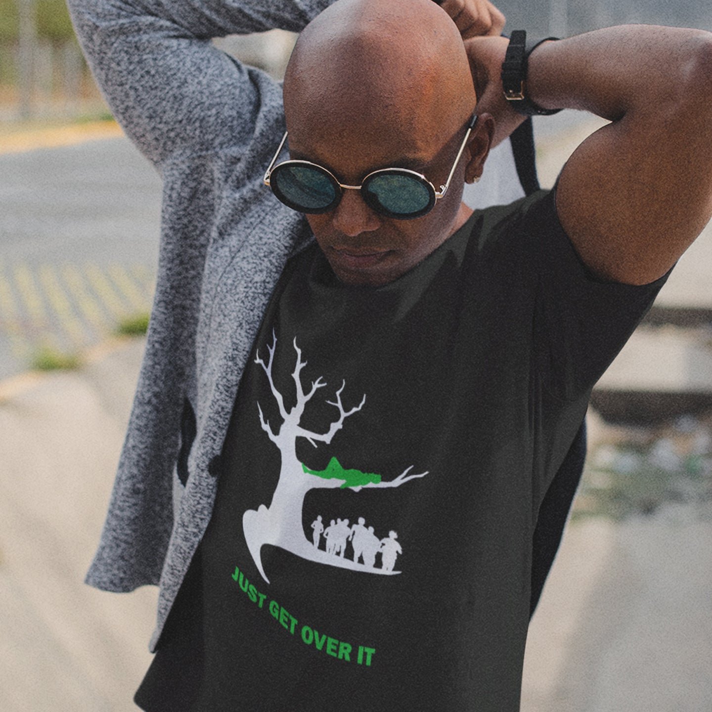 Man wearing a black t-shirt with a graphic design and text, outdoors. This sarcastic slogan t shirt design is for everyone who doesn't need a motivational one liner to find their pace of life. Ideal for the laid back independent thinking individual. Made from 100% organic ring-spun cotton, this urban art t-shirt is unisex, high-quality, super comfy, and best of all, eco-friendly.