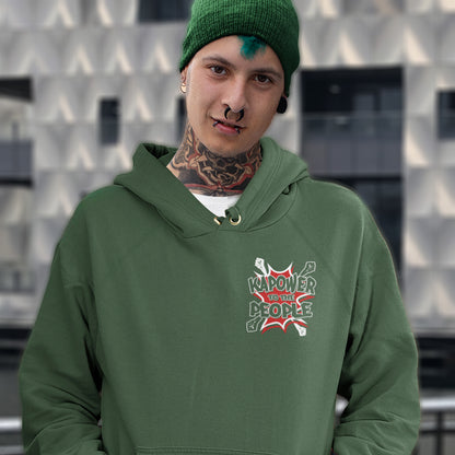 Person wearing a bottle green hoodie with a logo and text, standing against a patterned wall. An anti-government hoodie design that packs a punch with this humorous play on the slogan 'Power to the people', with a comic book twist. Support true democracy with this witty political message. Comfortable and practical. It's extra soft and has a convenient front pouch pocket. Made from organic cotton and recycled polyester, this social awareness hoodie is a great eco-friendly choice.