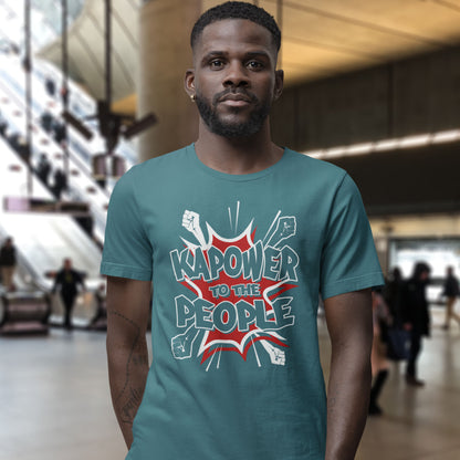 Man wearing a stargazer t-shirt with 'Kapower to the People' graphic in a blurred indoor setting. This anti government t shirt packs a punch with this humorous play on the slogan 'Power to the people', with a comic book twist. Support true democracy with this funny political message. Made from 100% organic ring-spun cotton, this unisex non conformist t shirt is a total must-have. It's high-quality, super comfy, and best of all, eco-friendly.