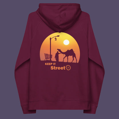 Burgundy hoodie back. This humorous, underground stencil art represents inner city street life as a culture of it's own. There is a ground level reality mixed with trustworthy honestly at street level in towns and cities across the planet. Wherever you are in the world, may the street be with you. Comfortable and practical. It's extra soft and has a convenient front pouch pocket. Made from organic cotton and recycled polyester, this street art hoodie is a great eco-friendly choice.