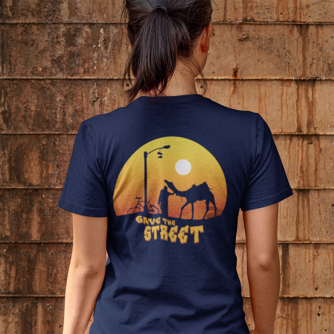Person wearing a navy blue t-shirt with a sunset design and 'Save the Street' text on the back. This street art t shirt stencil represents inner city street life as a culture of it's own. There is a ground level reality mixed with trustworthy honestly at street level in towns and cities across the planet. Wherever you are in the world, may the street be with you. Made from 100% organic ring-spun cotton, this urban art t shirt is unisex, high-quality, super comfy, and best of all, eco-friendly.