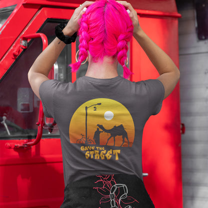 Person with pink hair wearing a t-shirt with a graphic design in front of a red vehicle. This street art t shirt stencil represents inner city street life as a culture of it's own. There is a ground level reality mixed with trustworthy honestly at street level in towns and cities across the planet. Wherever you are in the world, may the street be with you. Made from 100% organic ring-spun cotton, this urban art t shirt is unisex, high-quality, super comfy, and best of all, eco-friendly.