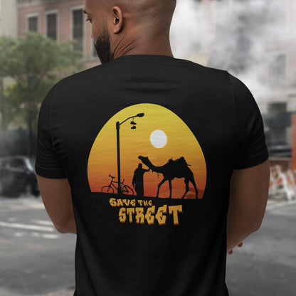 Person wearing a black t-shirt with a graphic design on the back. This street art t shirt stencil represents inner city street life as a culture of it's own. There is a ground level reality mixed with trustworthy honestly at street level in towns and cities across the planet. Wherever you are in the world, may the street be with you. Made from 100% organic ring-spun cotton, this urban art t shirt is unisex, high-quality, super comfy, and best of all, eco-friendly.