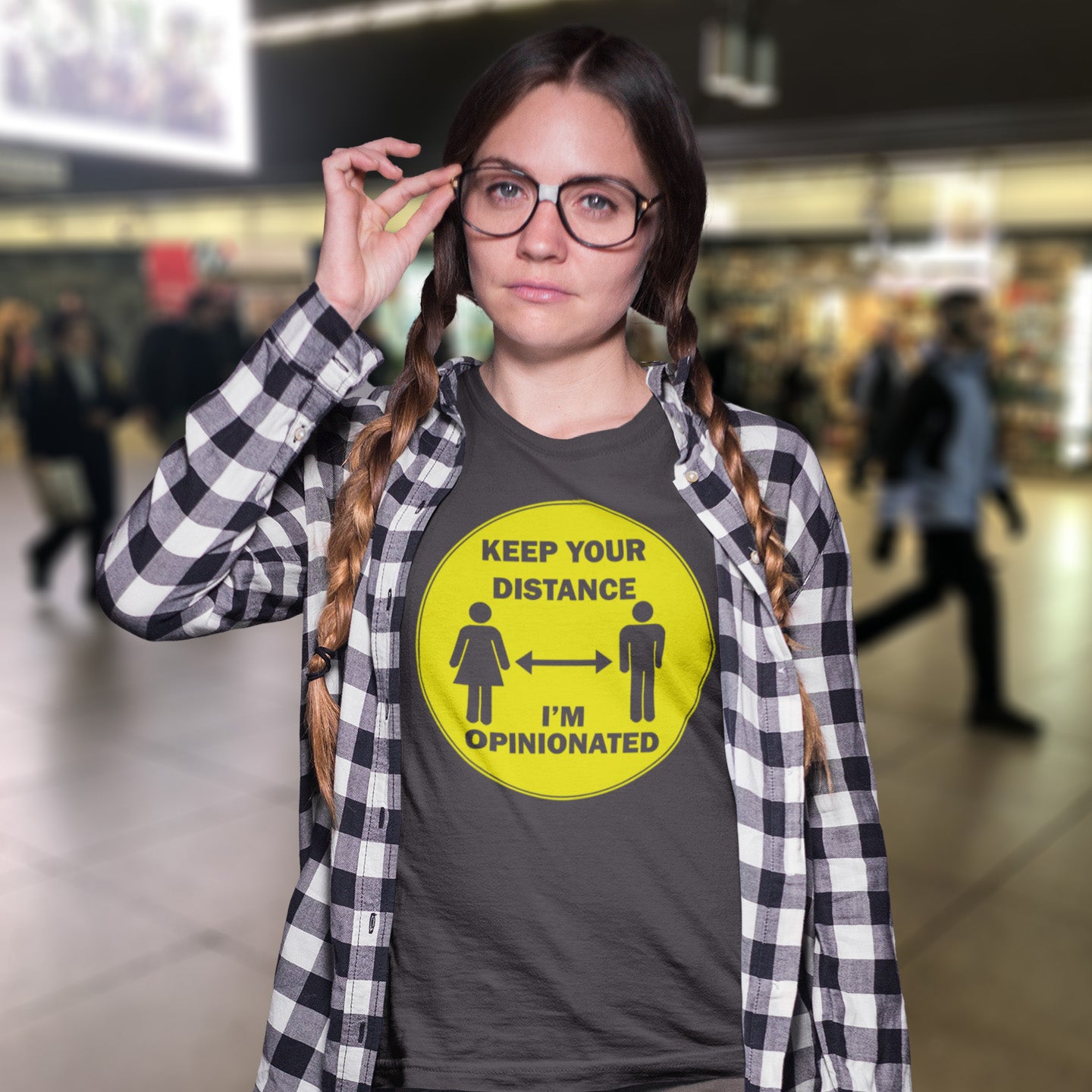 Woman wearing a t-shirt with a social distancing message in a public space. This opinionated t shirt design is a warning to people who speak before they think. It's best to warn them before they try to treat you like a clone. Made from 100% organic ring-spun cotton, this urban art t shirt is unisex, high-quality, super comfy, and best of all, eco-friendly.