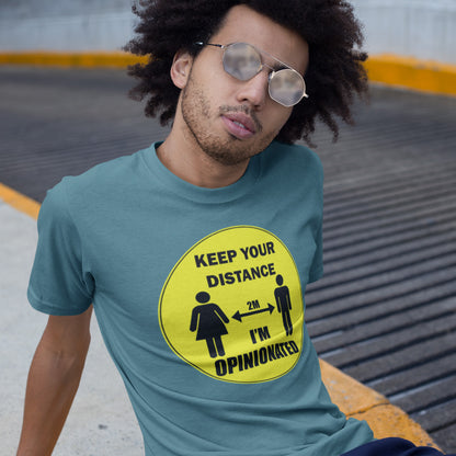 Person wearing a stargazer t-shirt with a yellow graphic and text, sitting on a concrete surface. This opinionated t shirt design is a warning to people who speak before they think. It's best to warn them before they try to treat you like a clone. Made from 100% organic ring-spun cotton, this urban art t shirt is unisex, high-quality, super comfy, and best of all, eco-friendly.