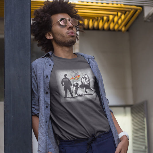 Man wearing a graphic t-shirt with a design of a lion and people, standing outdoors. A stencil graffiti t shirt design mocking how much security we have in the western world, from a Rastafarian view point. Made from 100% organic ring-spun cotton, this urban art t shirt is unisex, high-quality, super comfy, and best of all, eco-friendly.