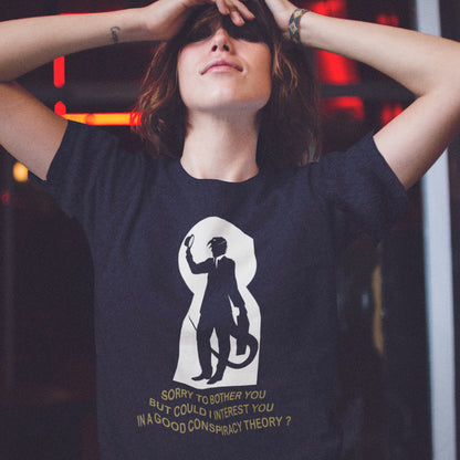 Person wearing a French navy t-shirt with a graphic design and text. A funny conspiracy theory t-shirt. Just an ordinary, everyday, door-to-door conspiracy theory salesman. Made from 100% organic ring-spun cotton, this reptilian alien t-shirt is unisex, high-quality, super comfy, and best of all, eco-friendly.