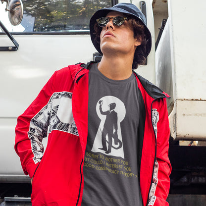 Person wearing a red jacket and anthracite t-shirt with a graphic design, standing in front of a white van. A funny conspiracy theory t-shirt. Just an ordinary, everyday, door-to-door conspiracy theory salesman. Made from 100% organic ring-spun cotton, this reptilian alien t-shirt is unisex, high-quality, super comfy, and best of all, eco-friendly.