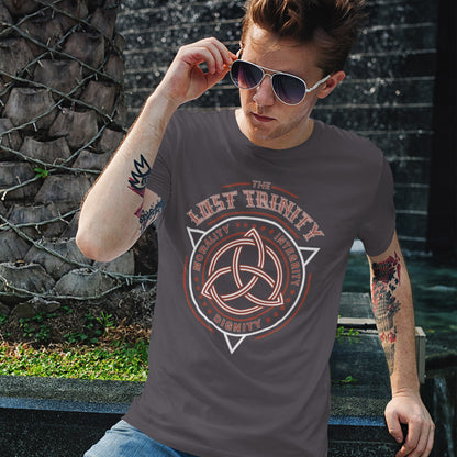 Man wearing a t-shirt with 'The Lost Trinity' design outdoors. A broken society t shirt reflecting a sign of the times. This unique design represents the erosion of morality in modern society and the loss of ethical thinking. As people are dehumanised and money is worshipped, is integrity a thing of the past ? Show your defiance with this original 'Lost Trinity design. Made from 100% organic ring-spun cotton, this counter culture t shirt is unisex, high quality, super comfy, and best of all, eco-friendly.