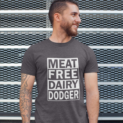 Man wearing a t-shirt with 'MEAT FREE DAIRY DODGER' text against a metal background. A vegan meat free t shirt promoting a witty alternative to the 'vegan' label. Never mind 'plant based' as a new label for vegan . This is straight off the streets of East London. Made from 100% organic ring-spun cotton, this vegan dairy free t shirt is unisex, high-quality, super comfy, and best of all, eco-friendly.