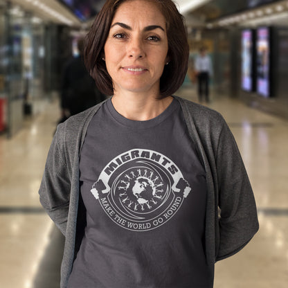 Woman wearing a anthracite t-shirt with a graphic design and text in an indoor setting. An anti racism t shirt showing support for migrants. If you believe that migrants help keep the gene pool fresh and encourage culture growth, or just believe there should be no borders, this migrant rights t shirt is for you. Made from 100% organic ring-spun cotton, this anti racism t shirt is unisex, high-quality, super comfy, and best of all, eco-friendly.