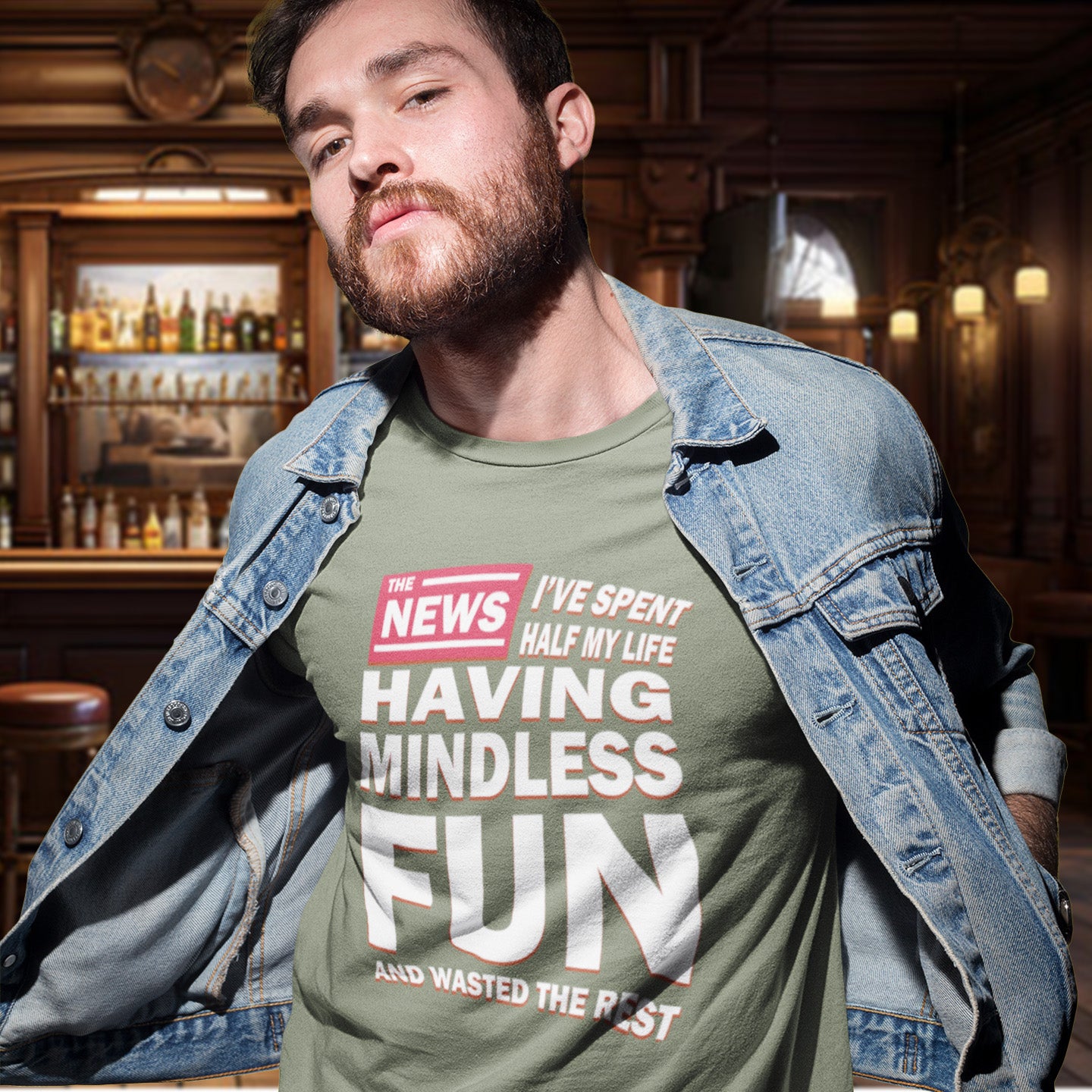 Man wearing a khaki t-shirt with humorous text in a bar setting. A witty quotes t shirt with a front page life philosophy. When you look back over your life, How are you going to see it ? Made from 100% organic ring-spun cotton, these clever slogan t shirts are unisex, high-quality, super comfy, and best of all, eco-friendly.