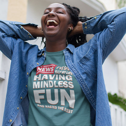 Person wearing a stargazer t-shirt with humorous text design, standing outdoors. A witty quotes t shirt with a front page life philosophy. When you look back over your life, How are you going to see it ? Made from 100% organic ring-spun cotton, these clever slogan t shirts are unisex, high-quality, super comfy, and best of all, eco-friendly.