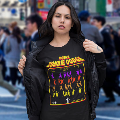 Woman wearing a black t-shirt with 'Mobile Zombie Dodge' graphic design in an urban setting. A funny gamer t shirt design for anyone who feels they are in a repetitive 80's video game every time they enter a crowded street scene. Welcome to the age of the mobile phone and lack of social awareness. Made from 100% organic ring-spun cotton, this unisex gamer t shirt is alternative and original. It's high-quality, super comfy, and best of all, eco-friendly.