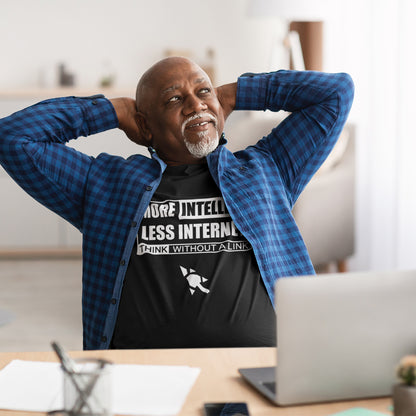 Man sitting at a desk with hands behind his head, wearing a black t-shirt with text and a blue plaid shirt. A social issues t shirt design exposing how lazy the internet has made our thought process. Think without a link and keep your brain alive, or end up just believing what you're told. Made from 100% organic ring-spun cotton, this intelligent t shirt design is unisex, high-quality, super comfy, and best of all, eco-friendly.