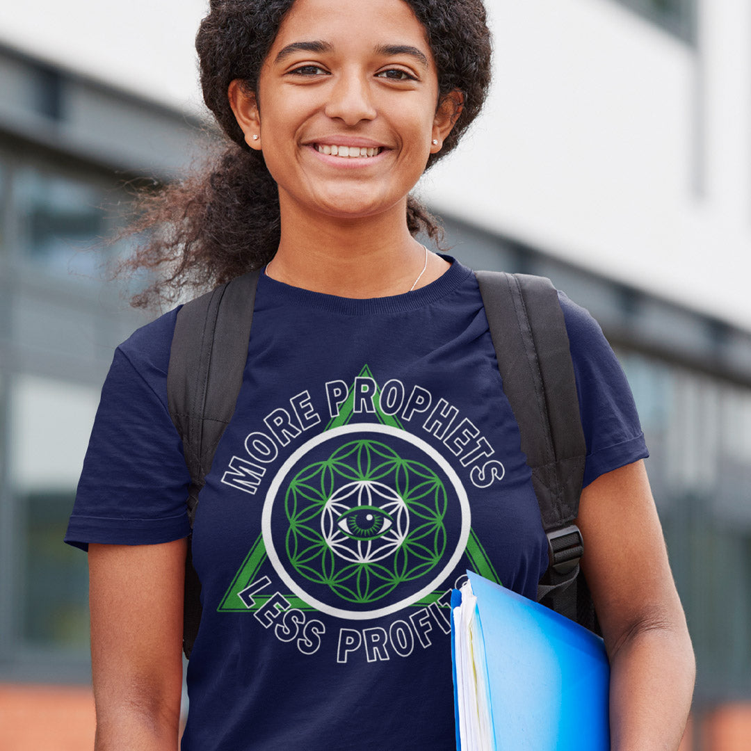 Person wearing a blue t-shirt with a graphic design and text, holding books and a backpack. This anti capitalism t shirt suggests we are following the wrong kind of profit. Society will never advance as a whole through greed but could really benefit from some ethical guidance. Made from 100% organic ring-spun cotton, this anti capitalist t shirt is unisex, high quality, super comfy, and best of all, eco-friendly.