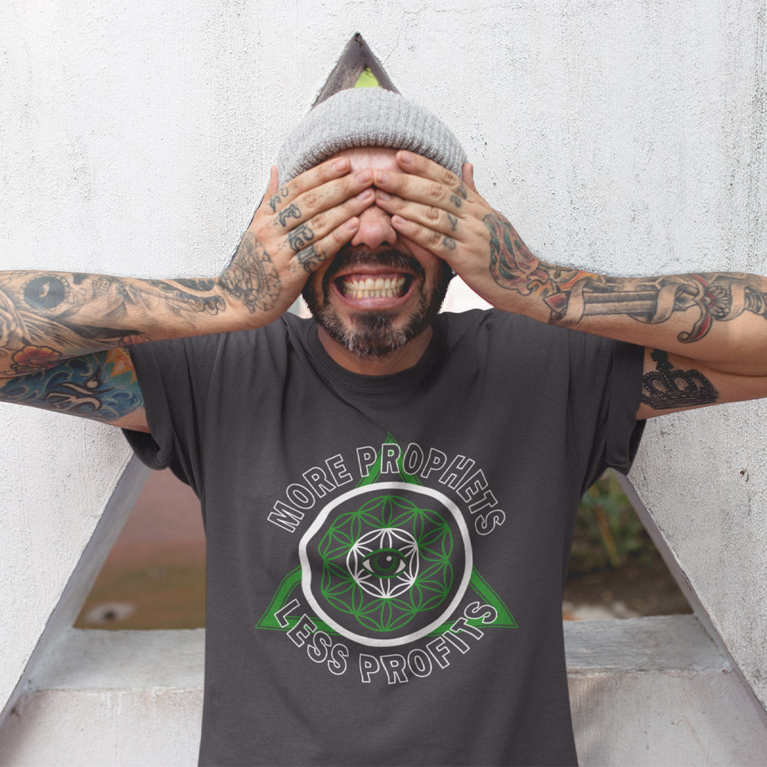 Man wearing a t-shirt with a graphic design and text, covering his face with his hands. This anti capitalism t shirt suggests we are following the wrong kind of profit. Society will never advance as a whole through greed but could really benefit from some ethical guidance. Made from 100% organic ring-spun cotton, this anti capitalist t shirt is unisex, high quality, super comfy, and best of all, eco-friendly.