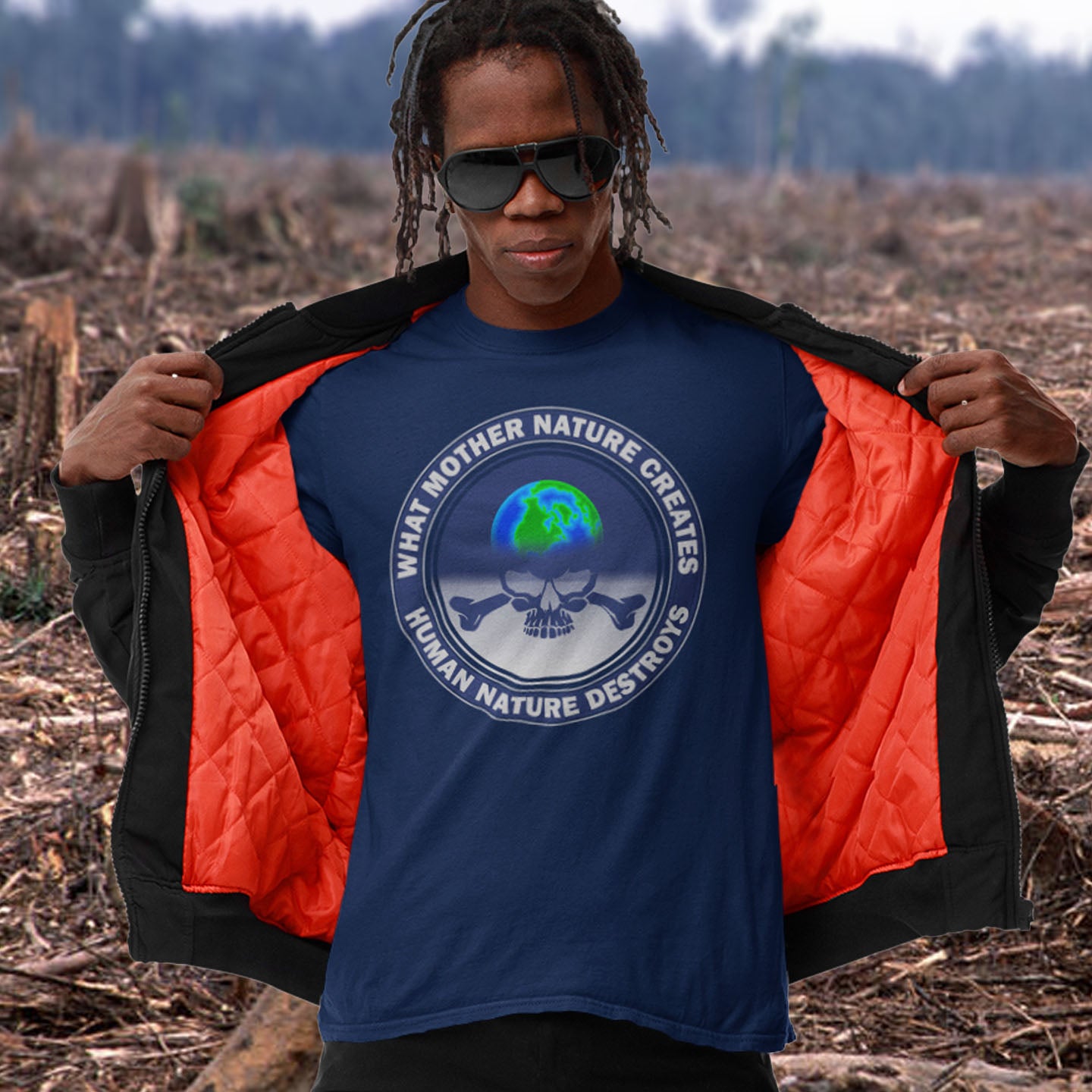 Person wearing a French navy t-shirt with a graphic design in a deforested area. A save the world t shirt. Mother nature vs. human nature. Environmental concern at it's rawest. A design for all eco warriors who would love to save the planet. Made from 100% organic ring-spun cotton, this save the planet t shirt design is unisex, high-quality, super comfy, and best of all, eco-friendly.