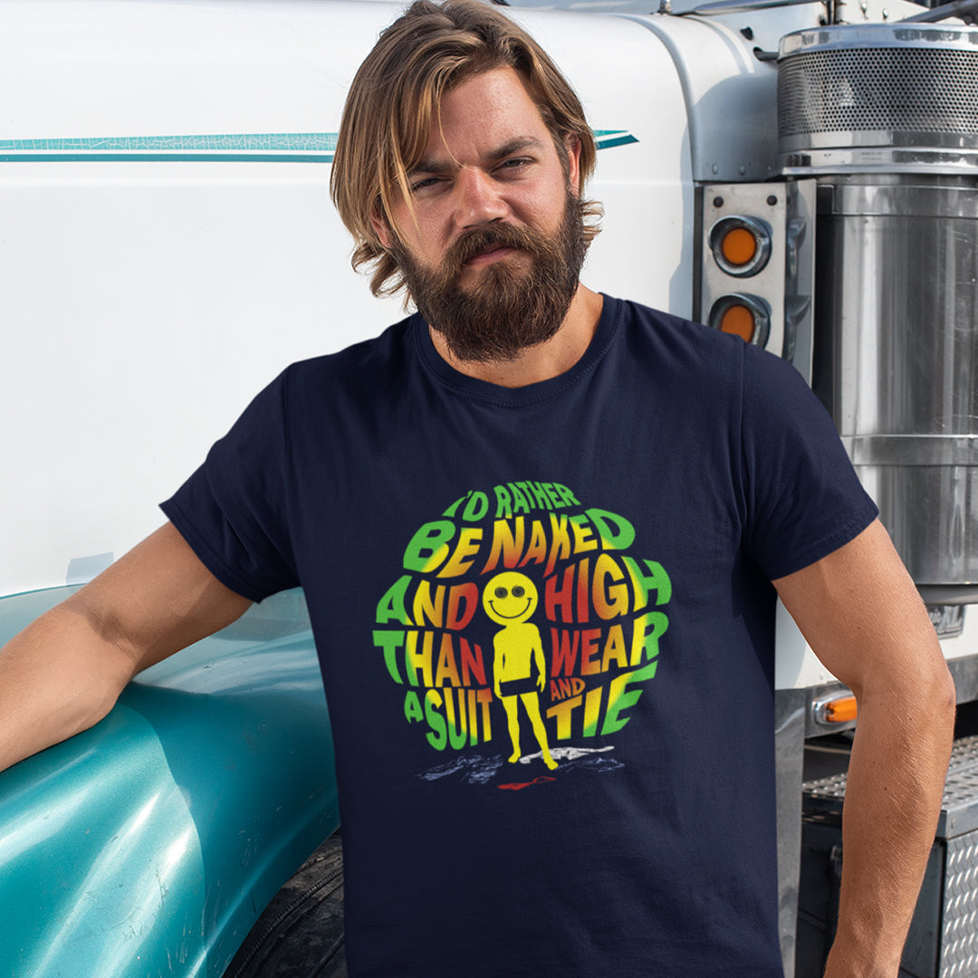 A man with a beard wearing a navy blue graphic t-shirt, leaning against a white semi-truck cab.