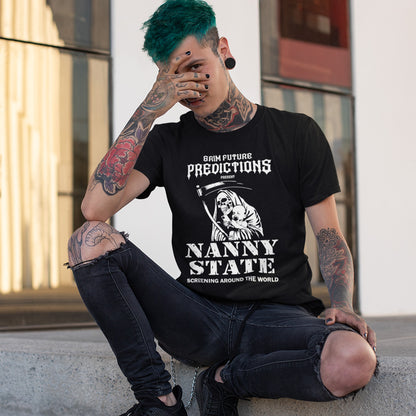 A tattooed man with bright green hair sits on a concrete ledge wearing a black graphic t-shirt that reads 'BORN FUTURE PREDICTIONS NANNY STATE'.