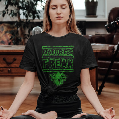 Woman meditating wearing a black t-shirt with 'Nature's Freak' design. A protect the planet t shirt design for all children of nature who are proud to be part of a beautiful eco system. This stencil graffiti t shirt is ideal if you believe you are surrounded by freaks of nature while feeling like one of nature's freaks. Made from 100% organic ring-spun cotton, this nature lover t shirt is unisex, high-quality, super comfy, and best of all, eco-friendly.
