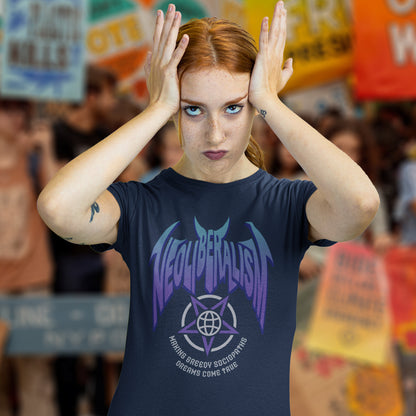Woman at protest rally wearing a French navy 'neoliberalism' t shirt. An anti capitalism t shirt in a satanic rock band style. This design pays satirical homage to the most overlooked treat to a CIVILISED society. Neoliberalism, the fertile breeding ground for greed and corruption. Made from 100% organic ring-spun cotton, this counter culture t shirt is unisex, high quality, super comfy, and best of all, eco-friendly.