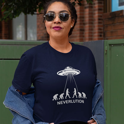 A woman wearing a navy blue graphic t-shirt with a white UFO and apes design that reads 'NEVERLUTION', styled with a denim jacket draped off her shoulders and sunglasses, set against an outdoor background.