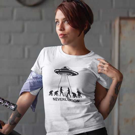 A woman wearing a white graphic t-shirt with a black print of an alien UFO and the word 'NEVERLUTION' next to an evolution sequence. She has a purple bandana tied around her arm and is posing in front of a gray brick wall.