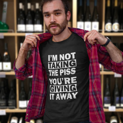 Man wearing a black t-shirt with humorous text in a wine store. A clever slogan t shirt design suggesting some people just set themselves up to be laughed at. Light hearted banter between friends , "No offence intended mate". Made from 100% organic ring-spun cotton, this sarcastic slogan t shirt is unisex, high-quality, super comfy, and best of all, eco-friendly.