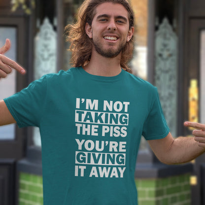 Man wearing a stargazer t-shirt with humorous text in an outdoor setting. A clever slogan t shirt design suggesting some people just set themselves up to be laughed at. Light hearted banter between friends , "No offence intended mate". Made from 100% organic ring-spun cotton, this sarcastic slogan t shirt is unisex, high-quality, super comfy, and best of all, eco-friendly.