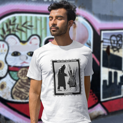 Man wearing a white t-shirt with a graphic design in front of a colourful mural. A stencil graffiti t shirt displaying a humorous view of how careful you have to be living in a culture of fear when you come from a more trusting generation. Made from 100% organic ring-spun cotton, this urban art t shirt is unisex, high-quality, super comfy, and best of all, eco-friendly.