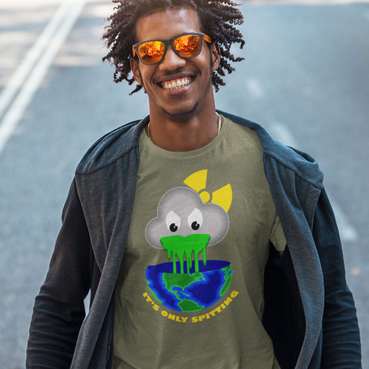 Man wearing a green t-shirt with a graphic design outdoors. A sarcastic climate awareness t-shirt. We can pretend we're not having a climate crisis but we'll pay for it later. This unique design is a dig at actionless optimism. Made from 100% organic ring-spun cotton, this environmental awareness t-shirt is unisex, high-quality, super comfy, and best of all, eco-friendly.