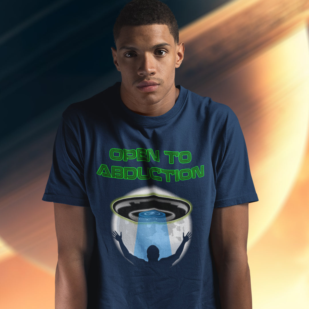 Man wearing an "OPEN TO ABDUCTION" French navy t shirt.