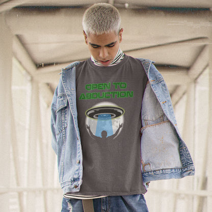 Man standing outside wearing an anthracite coloured "OPEN TO ABDUCTION" t shirt.