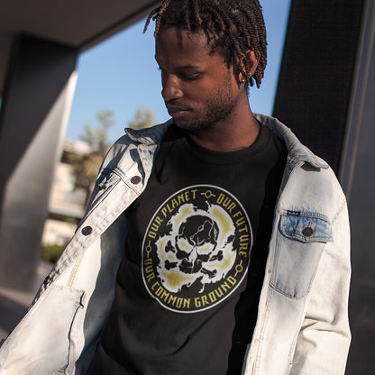 Person wearing a black t-shirt with a graphic design and text, standing outdoors. A save the planet t shirt for nature lovers who have environmental concern. Planet welfare should be something we can all agree on. Made from 100% organic ring-spun cotton, this save the Earth t shirt is unisex, high-quality, super comfy, and best of all, eco-friendly. Grey design.