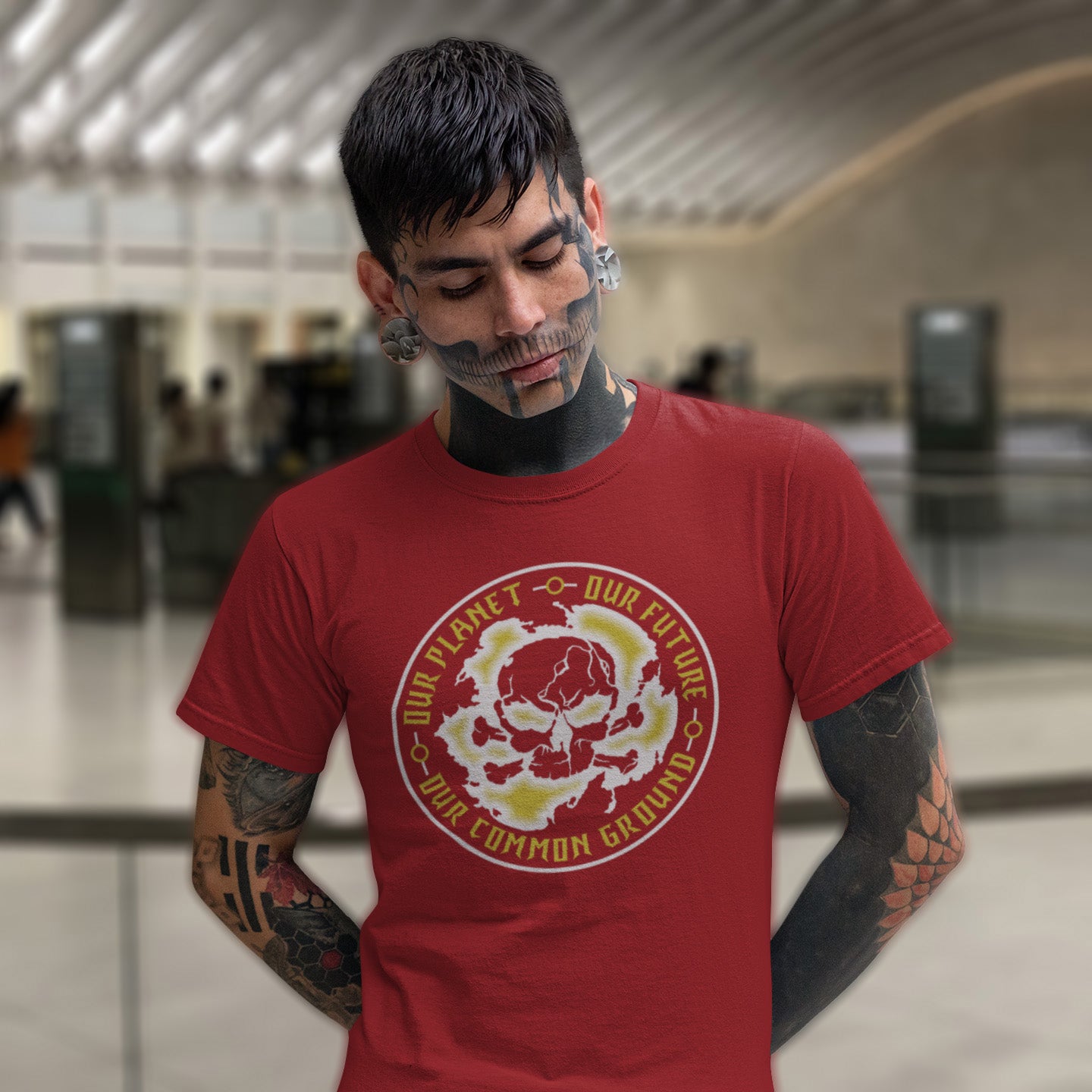 Man wearing a burgundy t-shirt with a graphic design in an indoor setting. A save the planet t shirt for nature lovers who have environmental concern. Planet welfare should be something we can all agree on. Made from 100% organic ring-spun cotton, this save the Earth t shirt is unisex, high-quality, super comfy, and best of all, eco-friendly. Grey design.