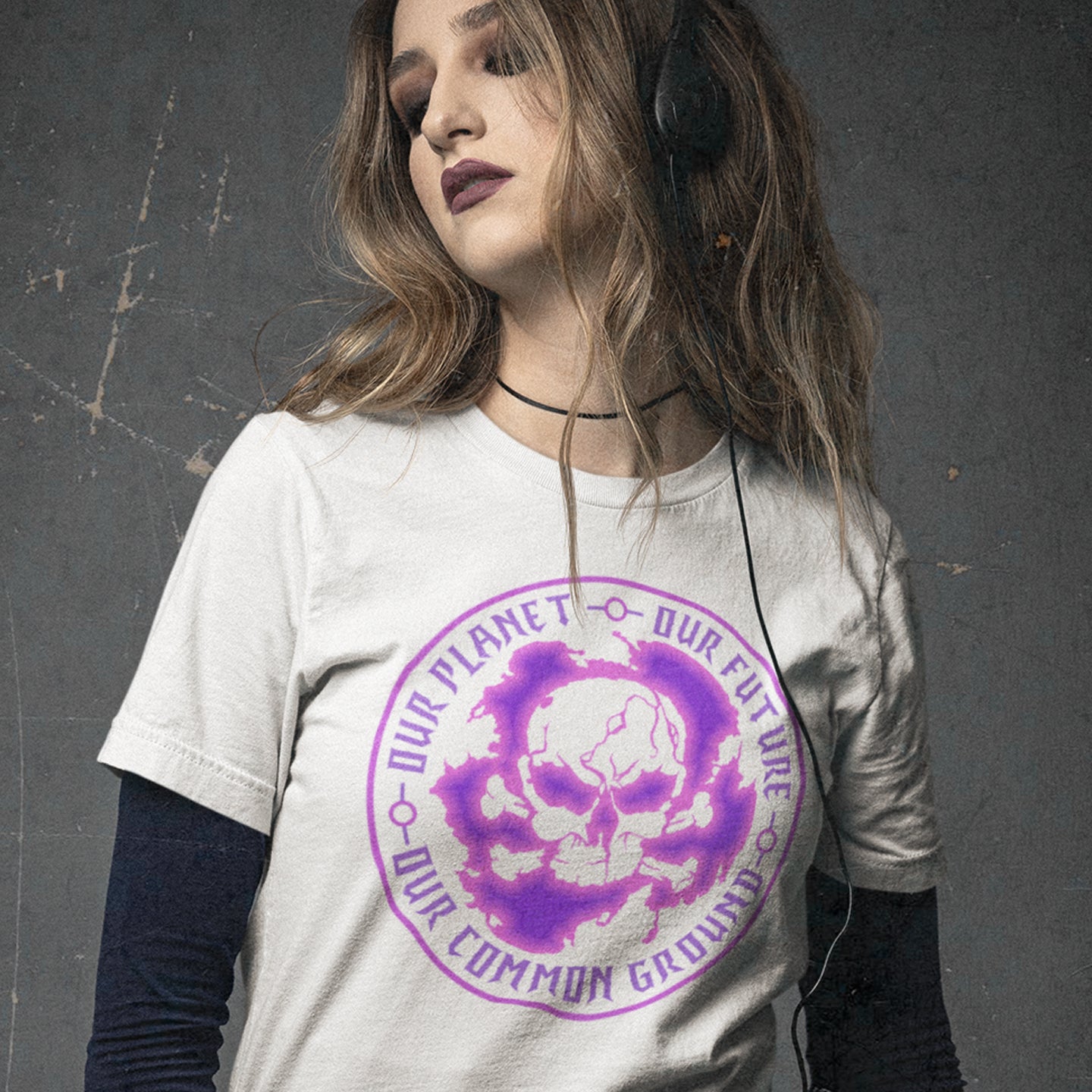 Person wearing a t-shirt with a purple graphic design and text on a dark background. An environmental concern t-shirt for nature lovers who want to save the planet. Planet welfare should be something we can all agree on. Made from 100% organic ring-spun cotton, this climate concern t-shirt is unisex, high-quality, super comfy, and best of all, eco-friendly.
