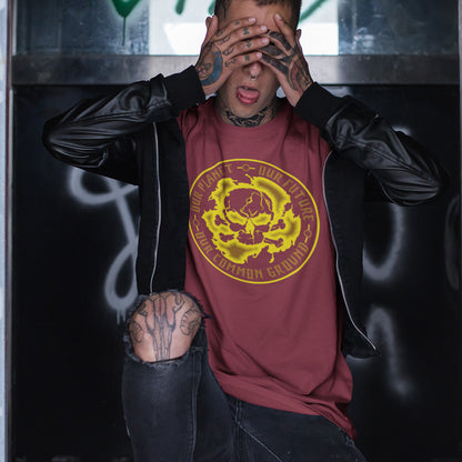 Person wearing a maroon t-shirt with a yellow graphic design, sitting against a dark background. An environmental concern t-shirt for nature lovers who want to save the planet. Planet welfare should be something we can all agree on. Made from 100% organic ring-spun cotton, this climate concern t-shirt is unisex, high-quality, super comfy, and best of all, eco-friendly. yellow design.