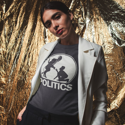 Person wearing a t-shirt with a graphic design and text, standing against a textured gold and black background. An anti government t shirt representing the simple inner workings of politics. Are they not stabbing the working class in the back to help the rich get richer ? Show your disapproval with this urban art t shirt. Made from 100% organic ring-spun cotton, this funny political t shirt is unisex, high-quality, super comfy, and best of all, eco-friendly.