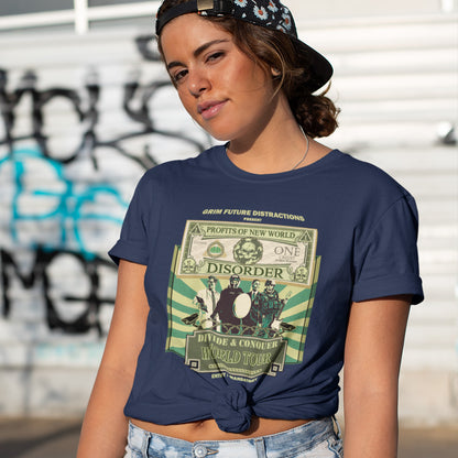 A woman wearing a cap, standing outside in a French navy blue t-shirt with a spoof world tour design of a band called "PROFITS OF NEW WORLD DISORER".