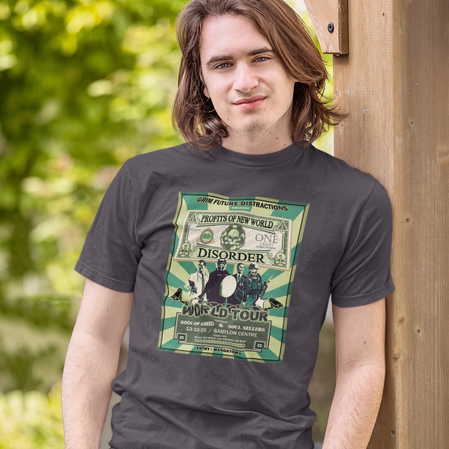 Person wearing a t-shirt with a graphic design of a dollar bill and text. A political t-shirt is in the style of a band tour poster. This satirical t-shirt design highlights the forces that influence our society now, and for the foreseeable future. A spoof band t-shirt to create social awareness. Made from 100% organic ring-spun cotton, this political satire t-shirt is unisex, high-quality, super comfy, and best of all, eco-friendly.