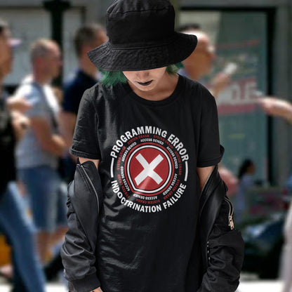 Person wearing a black t-shirt with a graphic design in an outdoor setting. A true conspiracy theory t-shirt. If you don't think from the same hive mind as those around you and you missed out on some media brainwashing you'll love this sarcastic and satirical view of indoctrination and human programming. Made from 100% organic ring-spun cotton, this satirical conspiracy theory t-shirt is unisex, high-quality, super comfy, and best of all, eco-friendly.